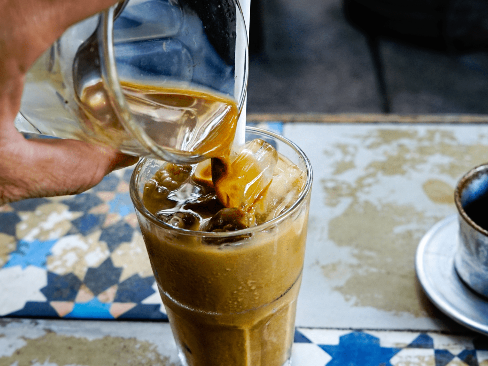 A glass of Vietnamese iced coffee with condensed milk.