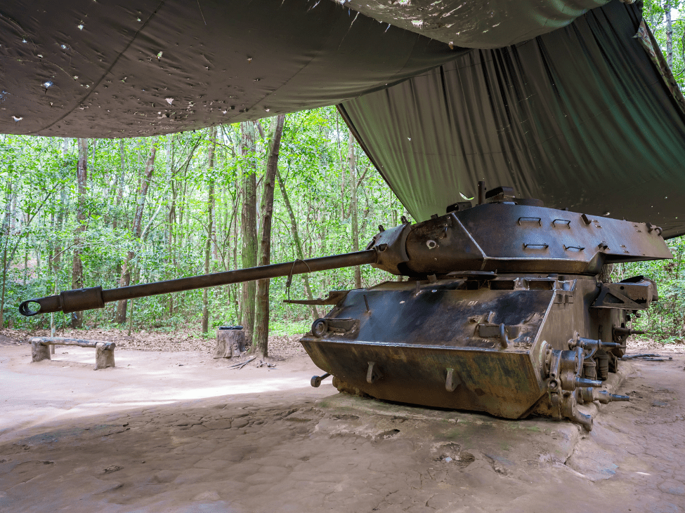 Travelers exploring the historic Cu Chi Tunnels in Vietnam.