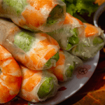 Fresh Vietnamese spring rolls with shrimp, vermicelli, and herbs.