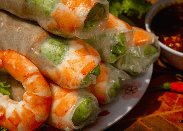 Fresh Vietnamese spring rolls with shrimp, vermicelli, and herbs.