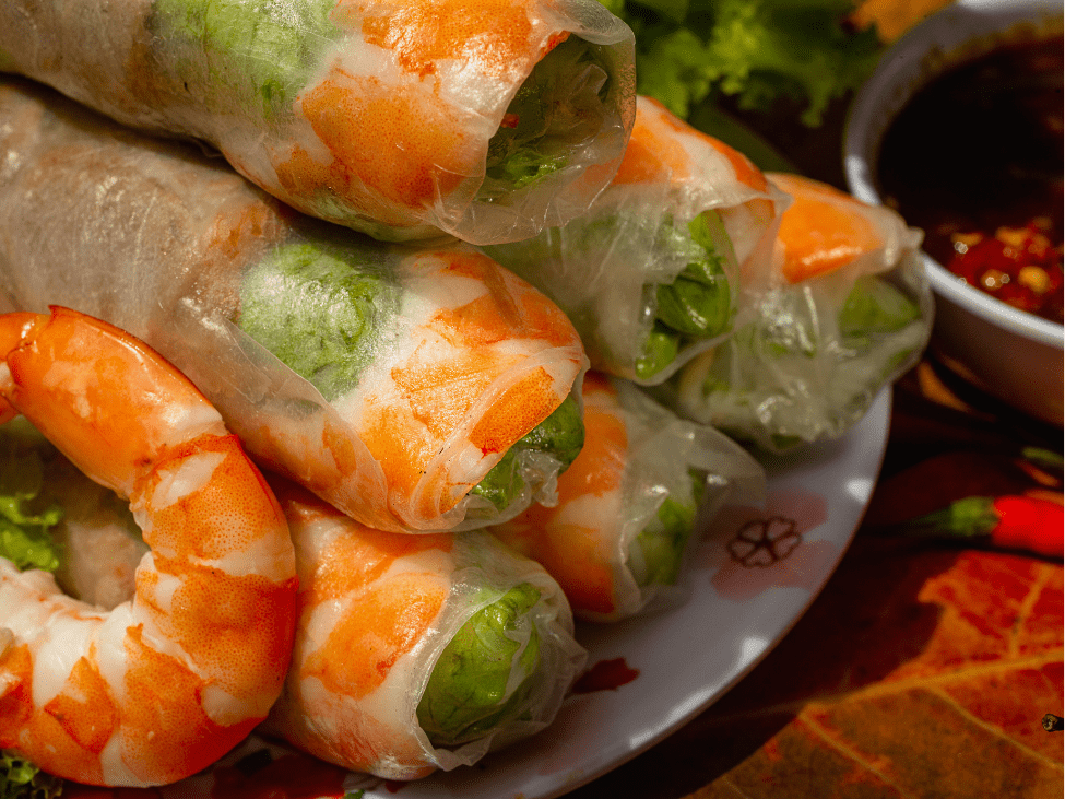 Fresh Vietnamese spring rolls with shrimp, vermicelli, and herbs.