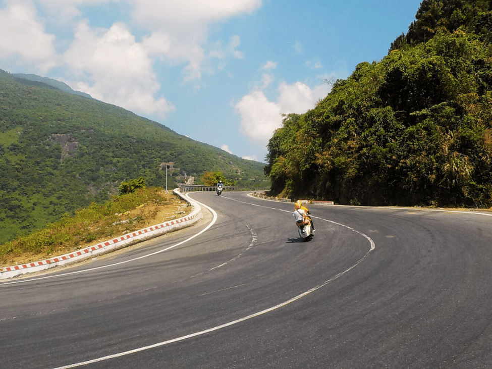 Motorcyclists riding along the scenic Hai Van Pass in Vietnam.