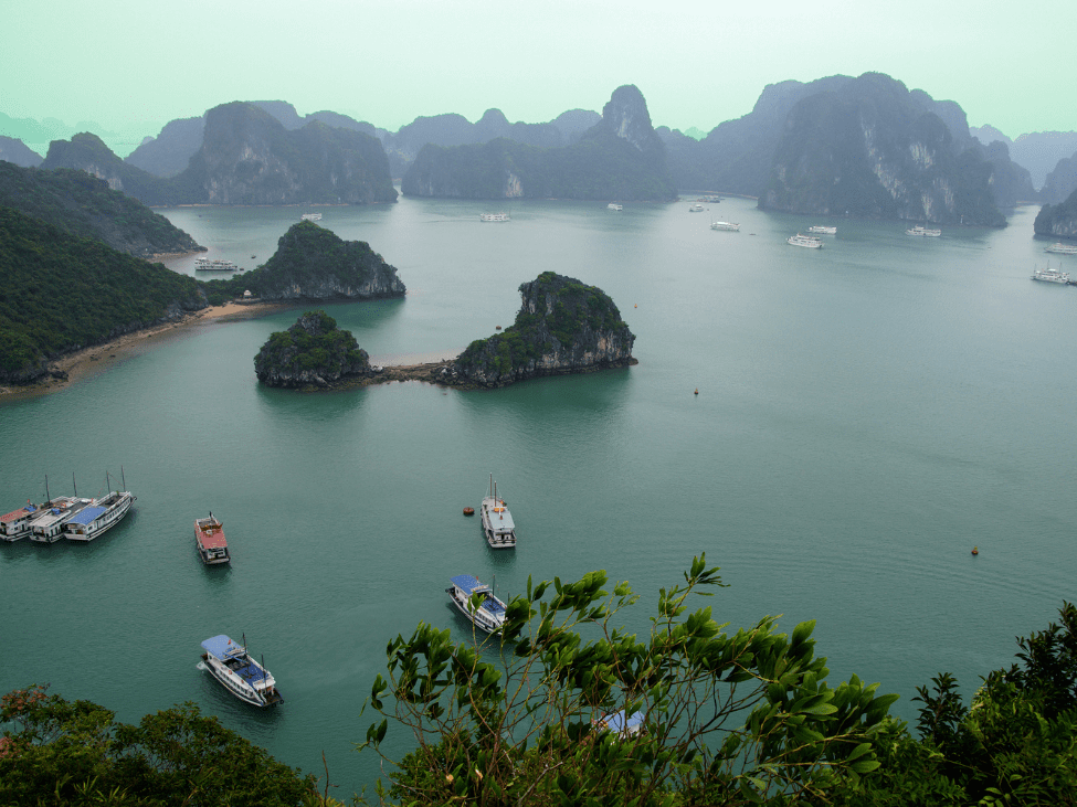 Mist-covered limestone karsts in Halong Bay during winter