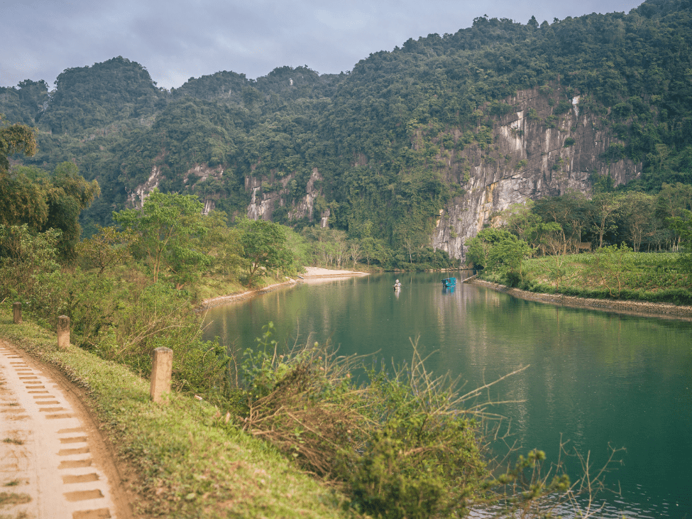 Hikers walking through the lush jungle in Phong Nha-Ke Bang National Park.