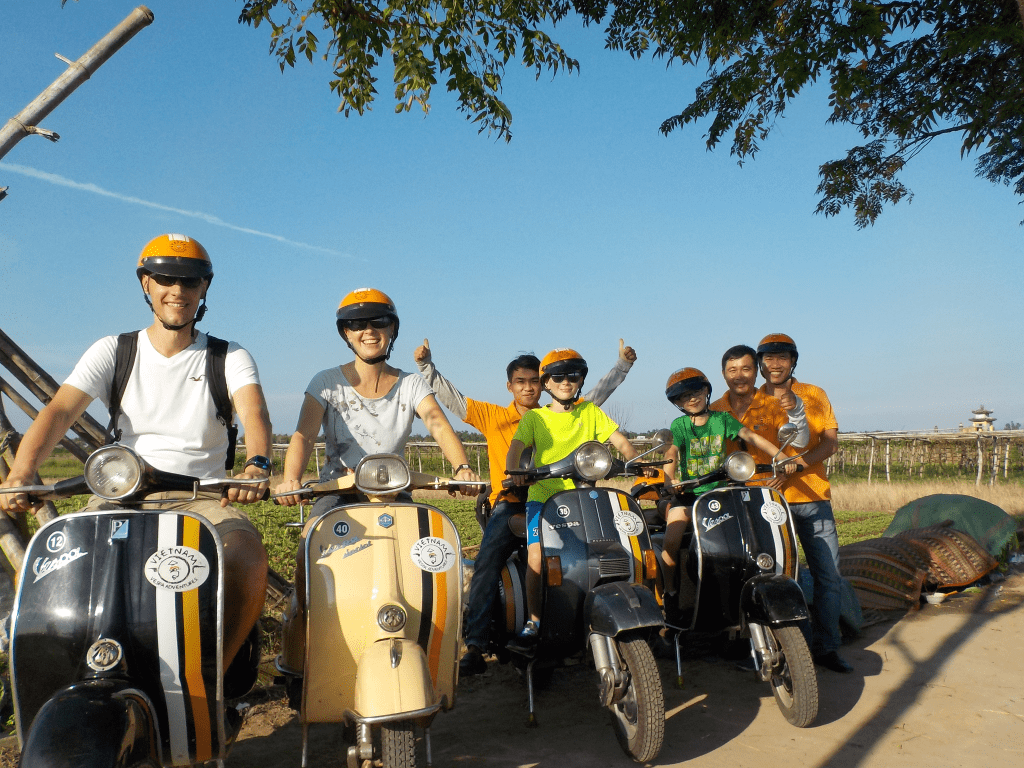 Family vespa through the rice paddies in Hoi An.