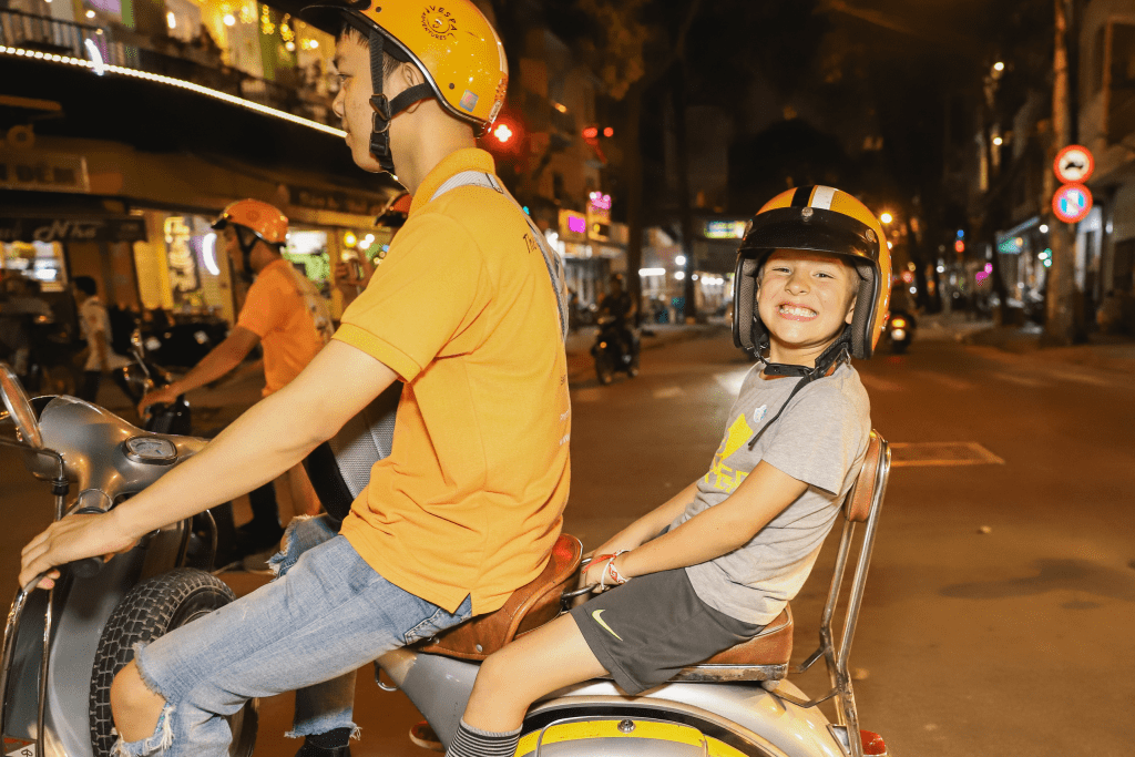 A family on a Vespa tour exploring Vietnam.