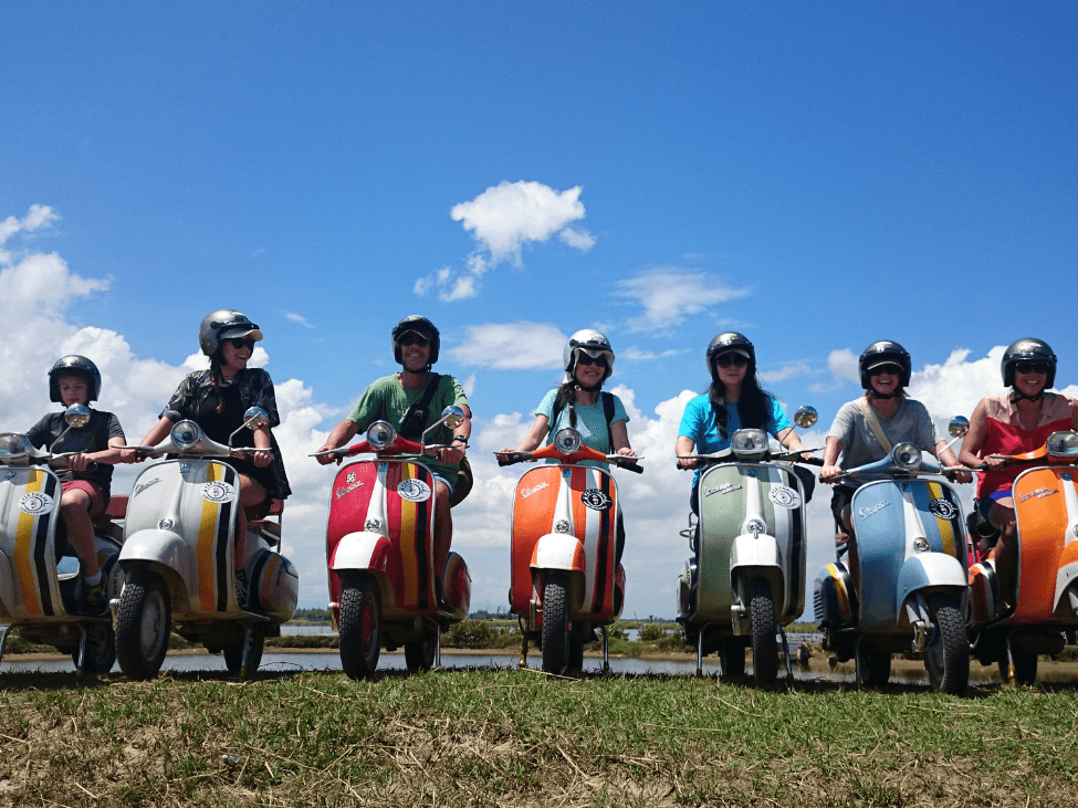 Family vespa through the rice paddies in Hoi An.