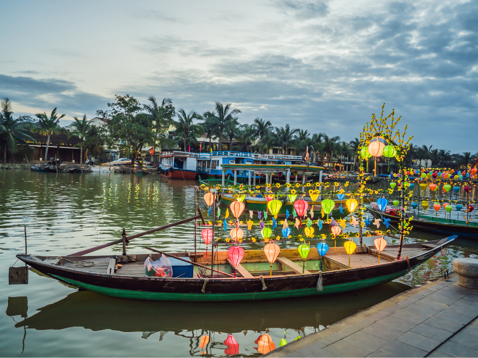 Lanterns reflecting on the waters of the Thu Bon River in Hoi An.