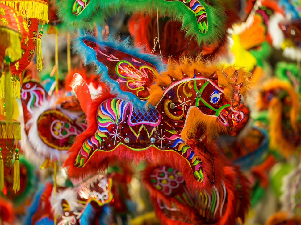 Family enjoying a festive lantern display during the Mid-Autumn Festival in Vietnam.