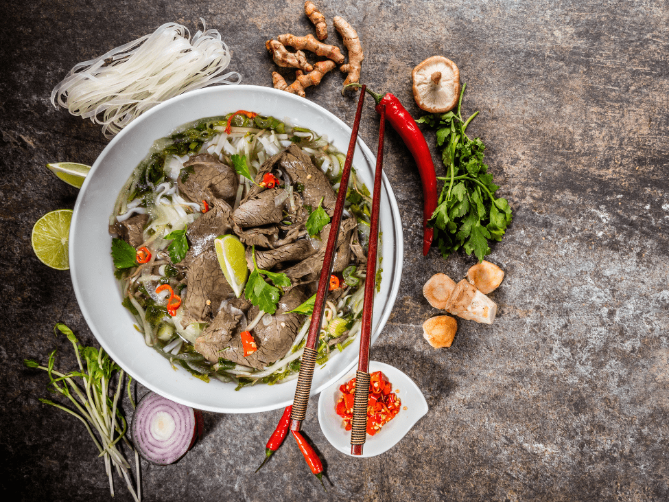 Pho Hung’s signature beef pho with fresh basil leaves and chili slices.