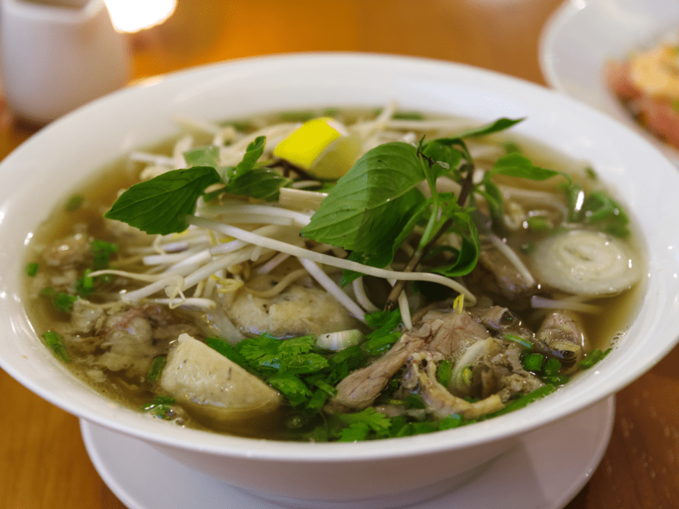 Pho Quynh’s pho with sliced beef, meatballs, and herbs.