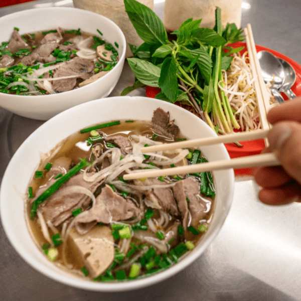 A variety of pho dishes, including beef, chicken, and vegetarian options.