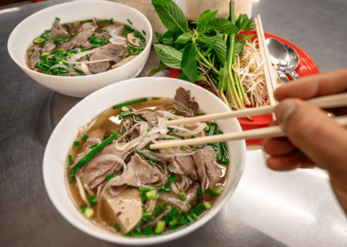 A variety of pho dishes, including beef, chicken, and vegetarian options.