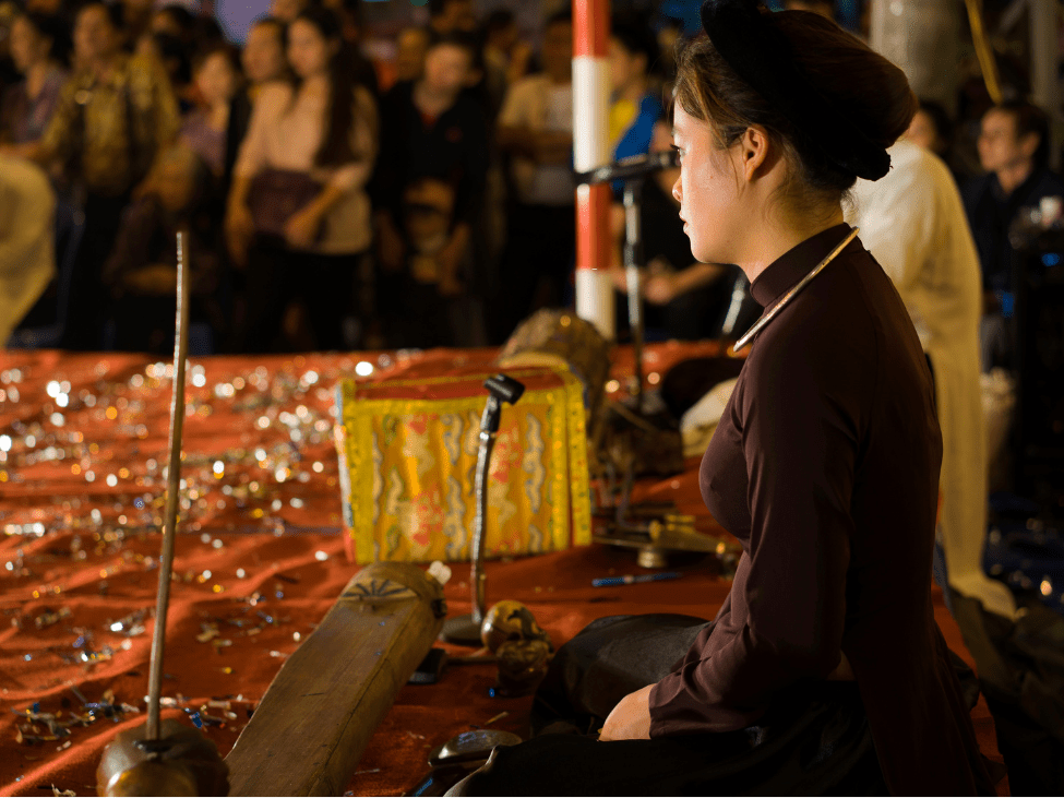 A Vietnamese musician plays the Dan Bau, a traditional instrument, during a cultural festival.