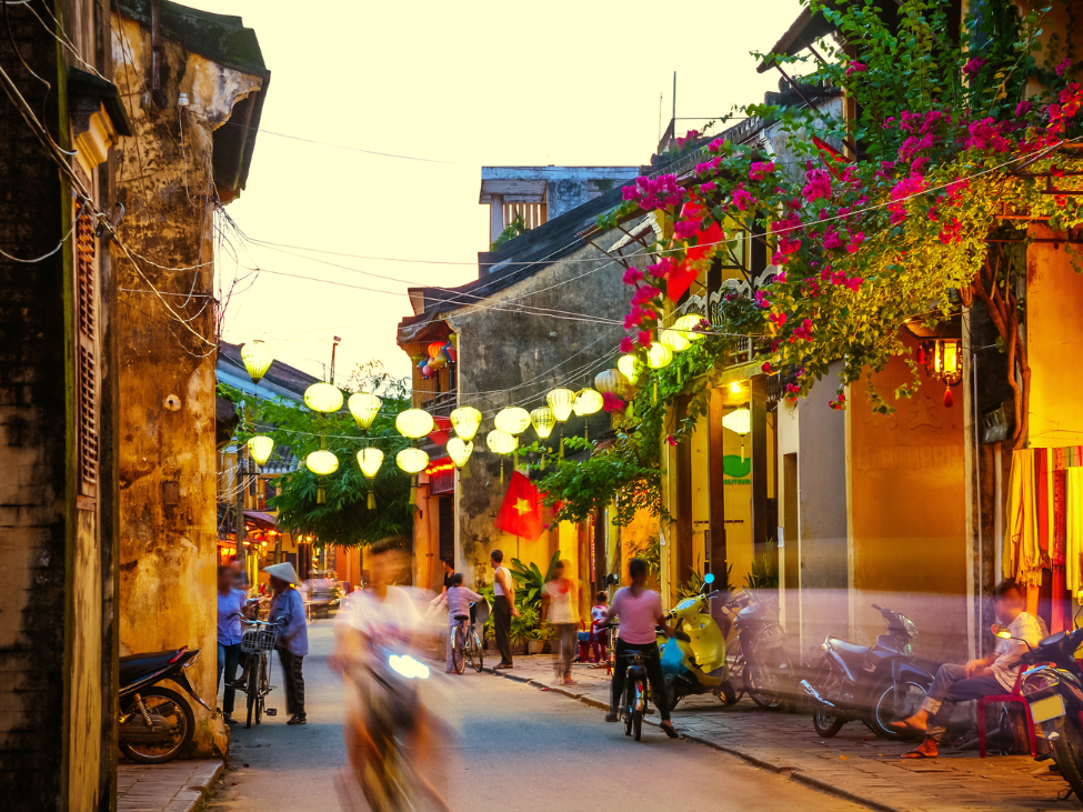 Cyclists riding through the picturesque countryside in Vietnam.