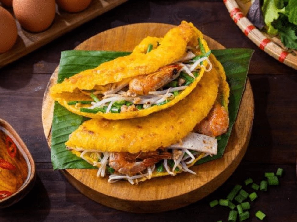 Vietnamese savory pancake banh khoai filled with shrimp and bean sprouts