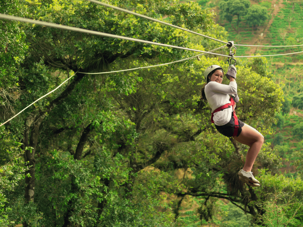 A zip-liner soaring over the jungle in Hue, Vietnam.