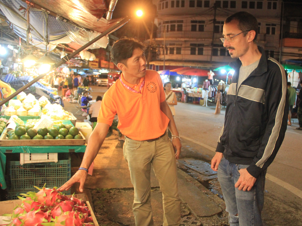 Tourists enjoying Chiang Mai’s bustling street markets at night. 