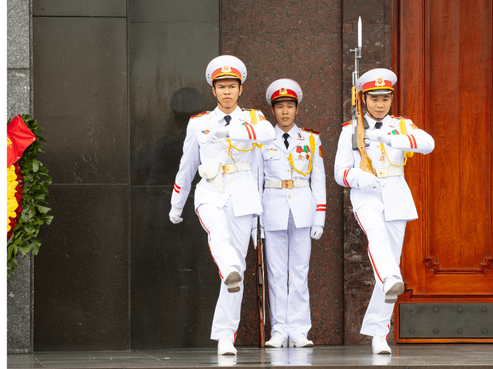 Visitors observing the changing of the guards at the Ho Chi Minh Mausoleum.