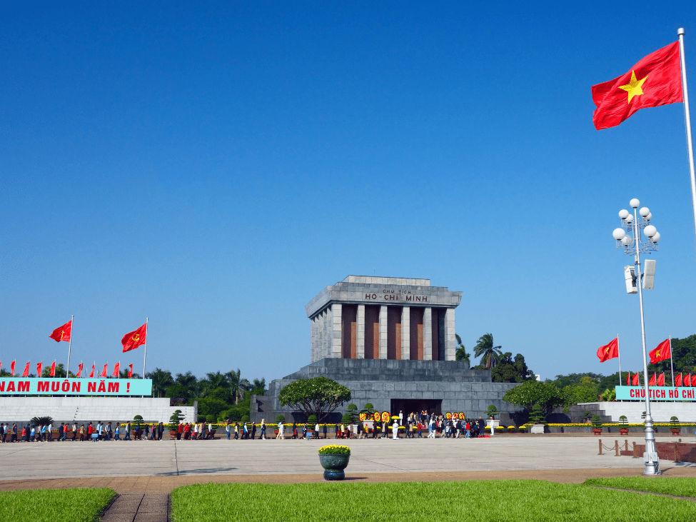 Tourists waiting in line outside the Ho Chi Minh Mausoleum in Hanoi.