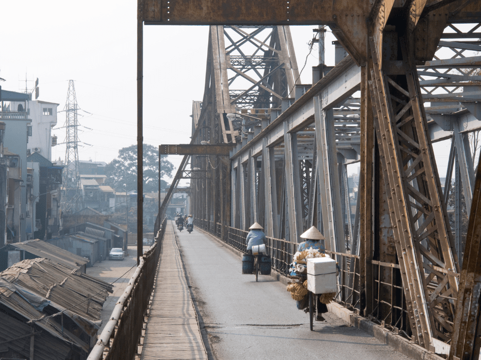 View of Long Bien Bridge from a nearby riverside café.