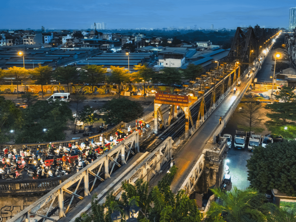 Sunset panorama of Long Bien Bridge with a view of the Red River.