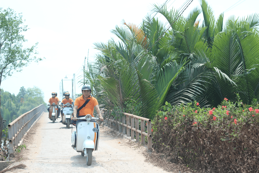 A Vespa ride through the peaceful coconut groves of the Mekong Delta.