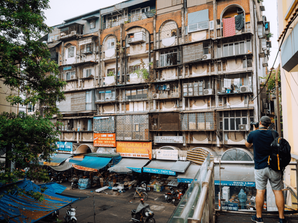 Tourists on vintage Vespas exploring Hanoi Old Quarter