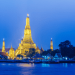 Ancient temple Wat Chedi Luang in Chiang Mai's Old City with a towering brick pagoda.