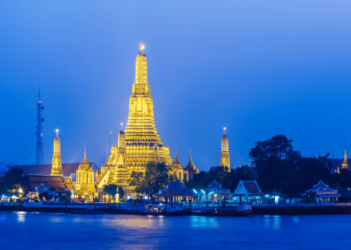 Ancient temple Wat Chedi Luang in Chiang Mai's Old City with a towering brick pagoda.