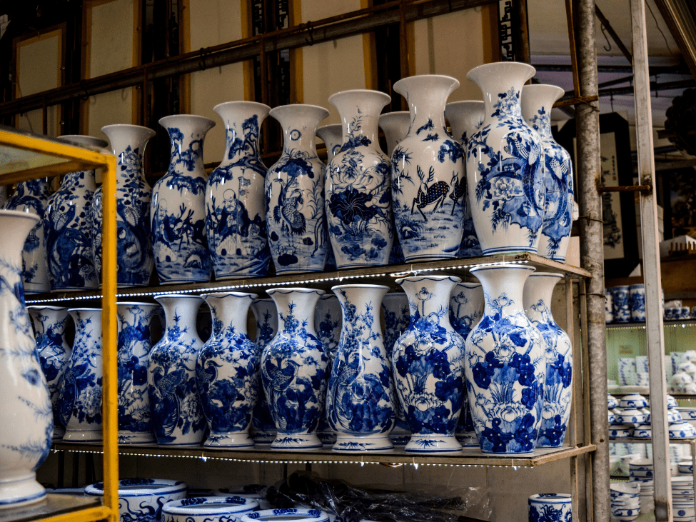 Artisan shaping clay at Bat Trang Ceramic Village near Hanoi.