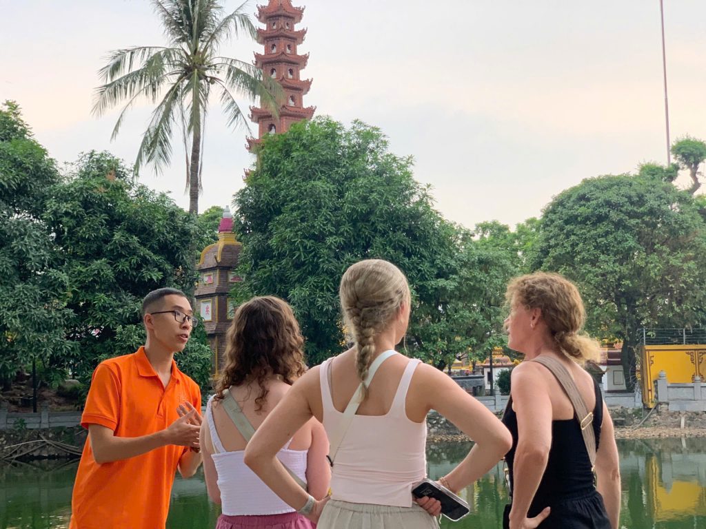 Travelers exploring Hanoi’s Old Quarter during Tet celebrations.